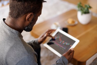 investor-looking-at-stock-prices-getty