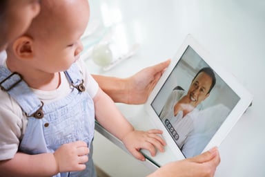 telemedicine baby looking at computer