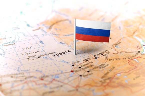 Russian flag pinned on map.