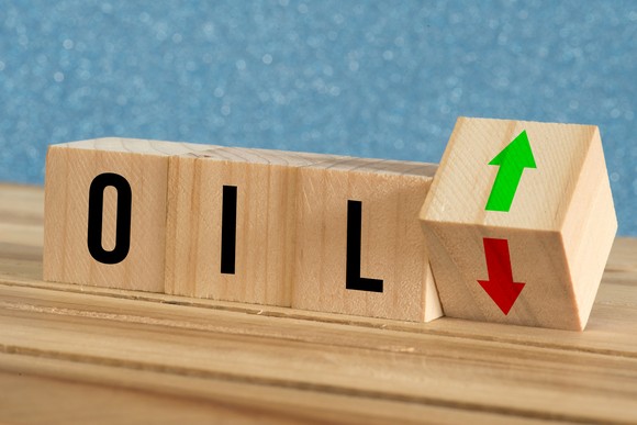 Blocks with letters spelling oil and a block with a down arrow turning to up arrow. 