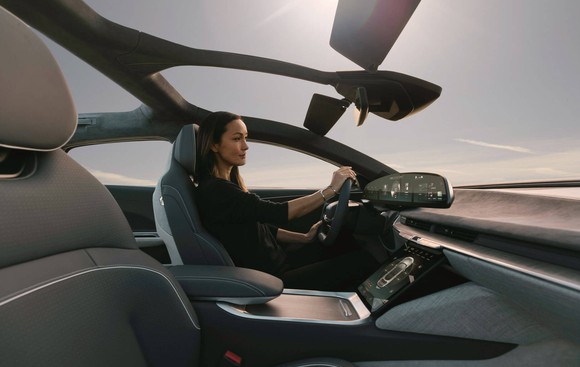 Person driving Lucid Air.