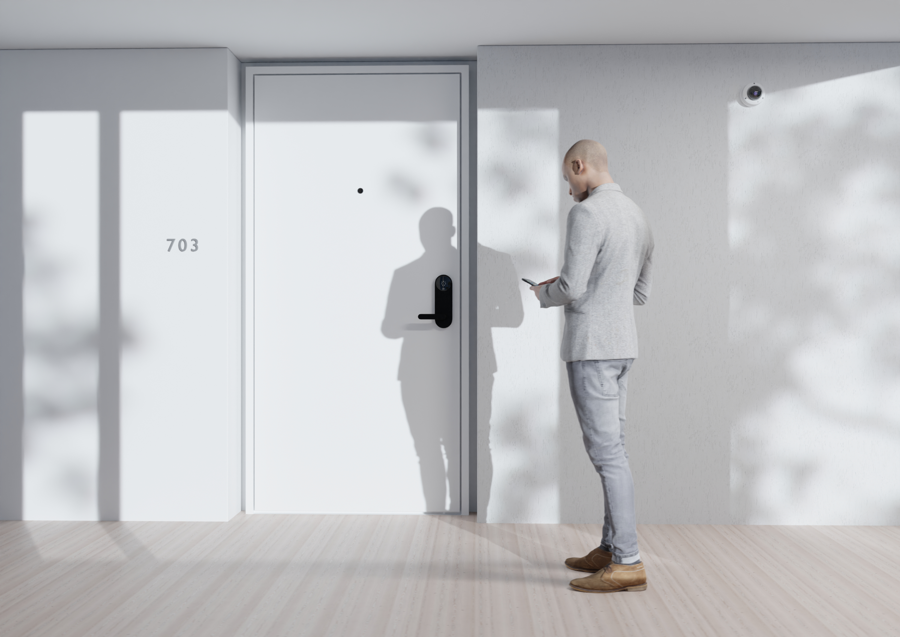 A man approaches an apartment door while looking at his smartphone. The person is using the smartphone to unlock a Latch-equipped door 