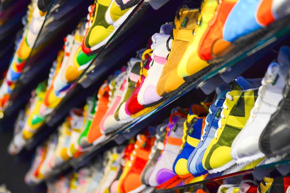 Colorful sneakers on racks.