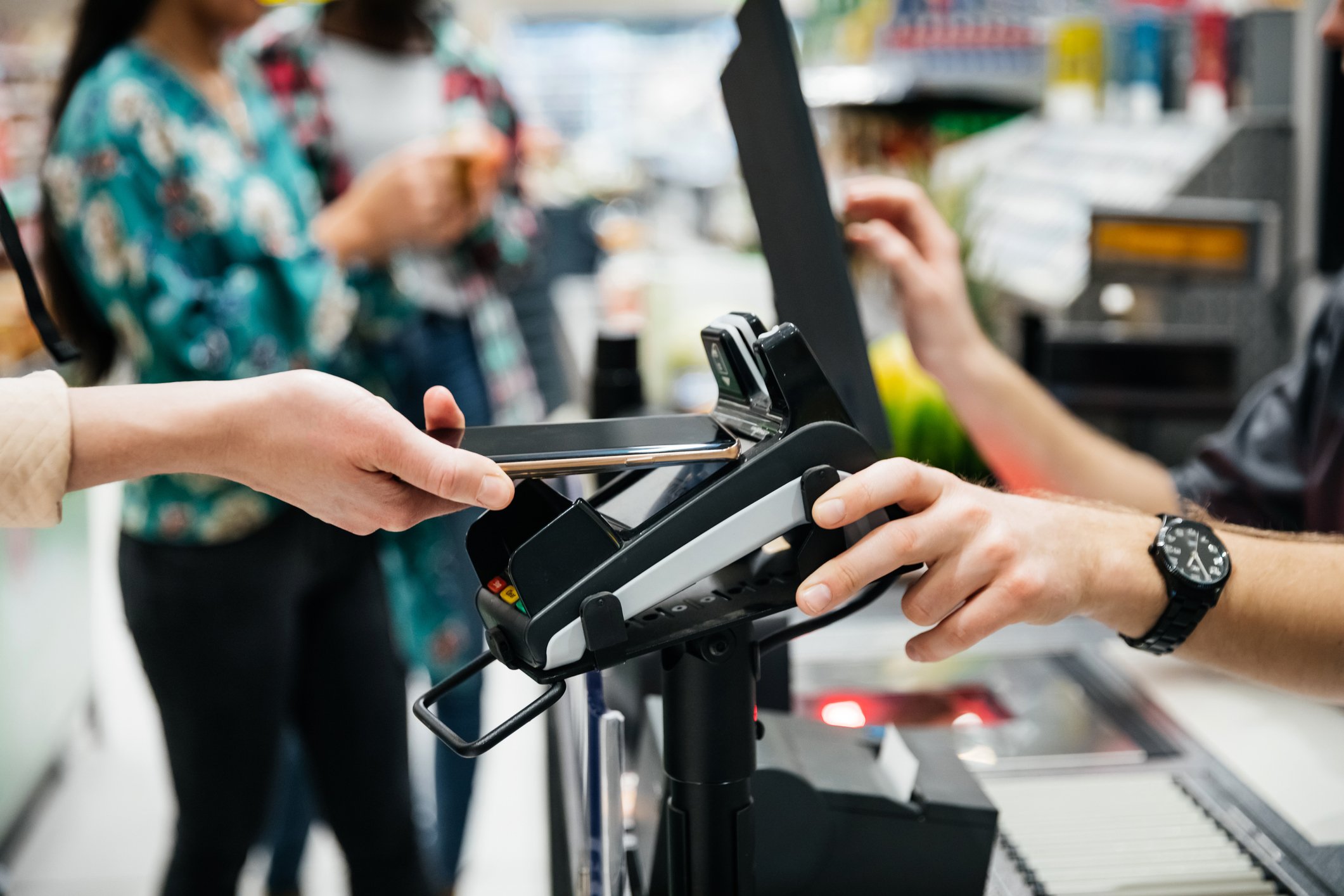 Person paying with a mobile device. 