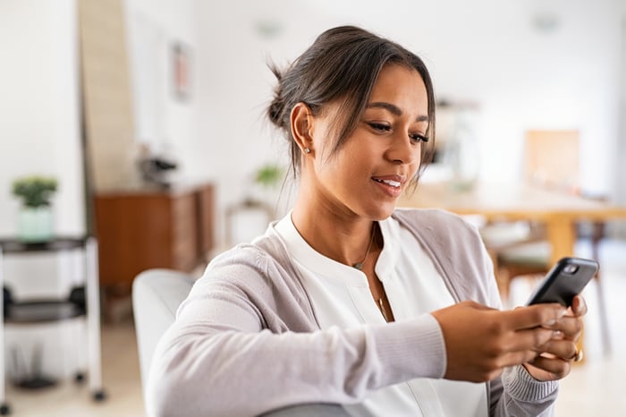 A person holding a smartphone.