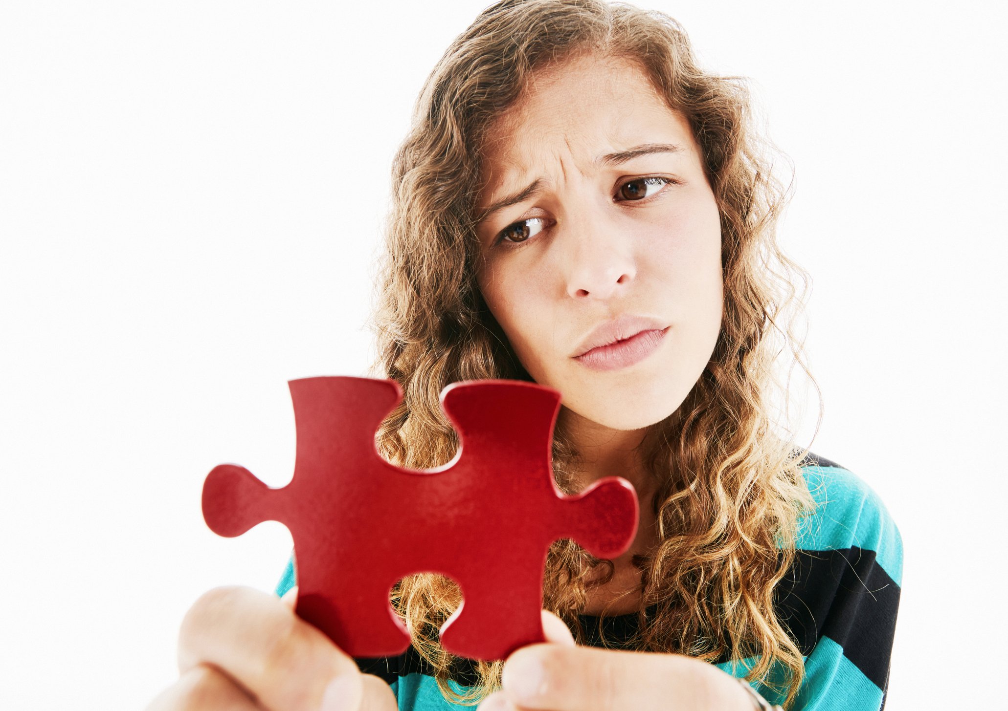 Person frowning at a big, red puzzle piece.
