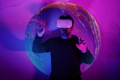man wearing VR glasses under neon lights