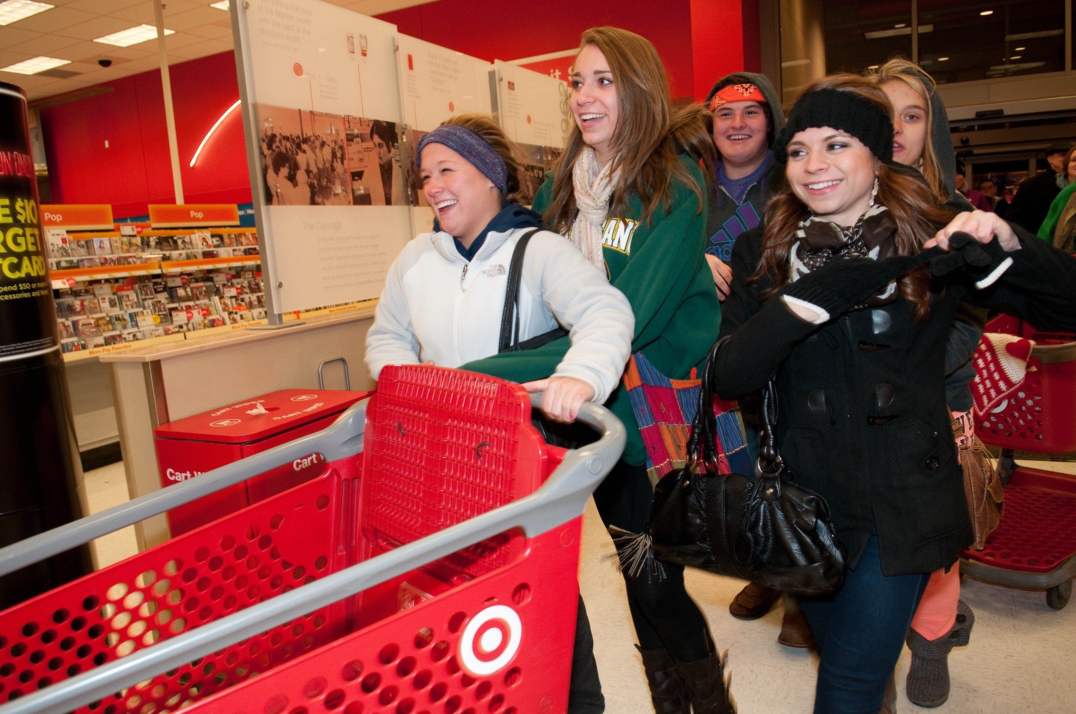 Customers in a Target store with a carriage.