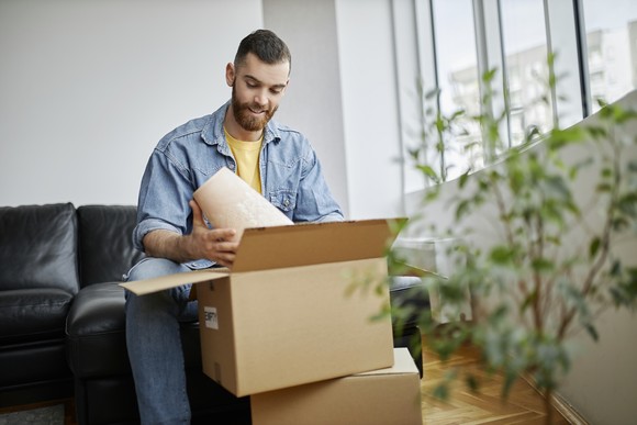 A person opening a package.