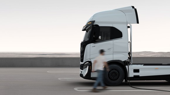 Nikola Tre BEV semi tractor plugged in for charging.