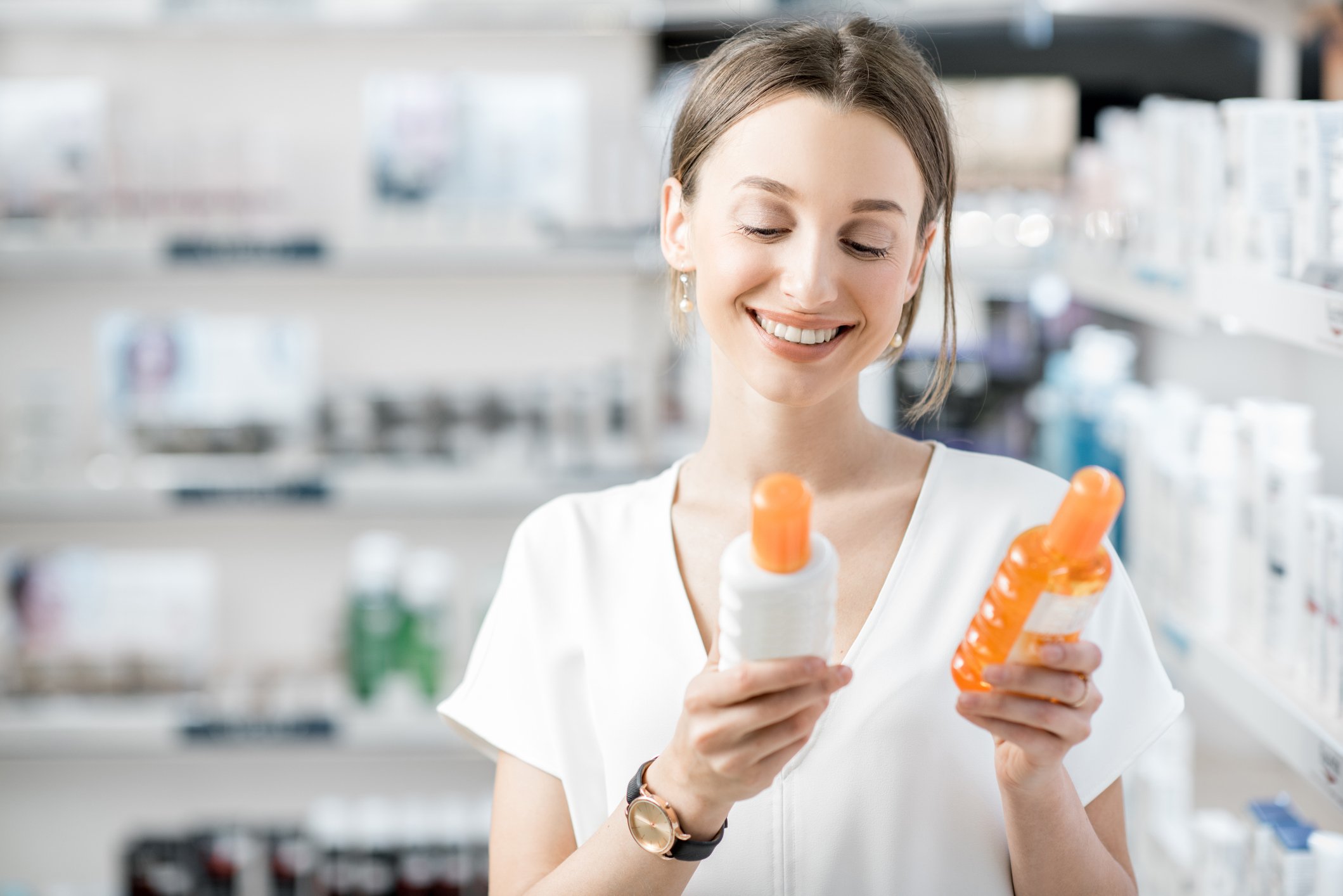 A shopper selecting skin care products.
