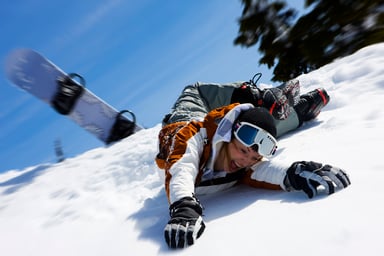 Snowboarder wipes out.