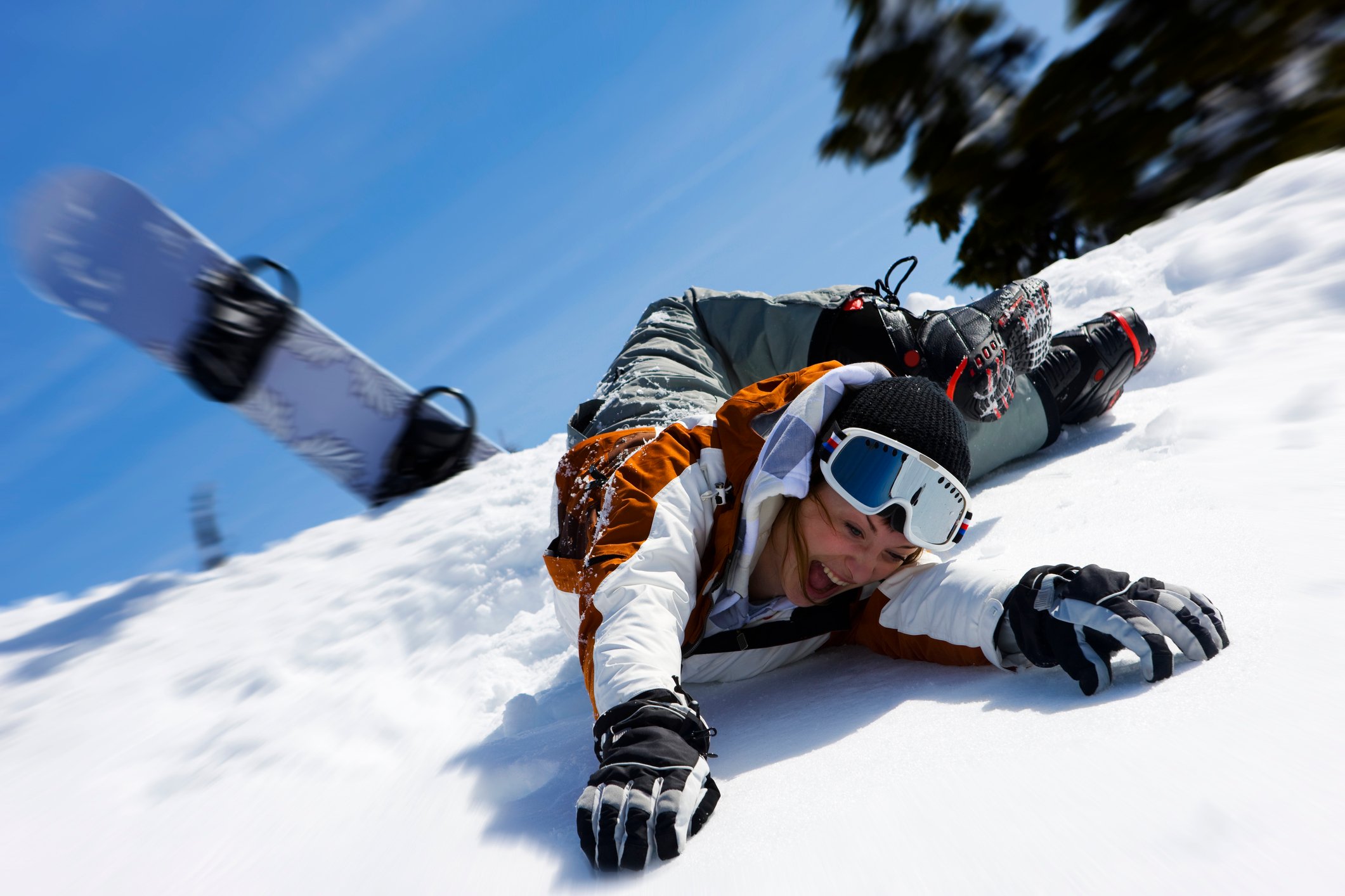 Snowboarder wipes out.