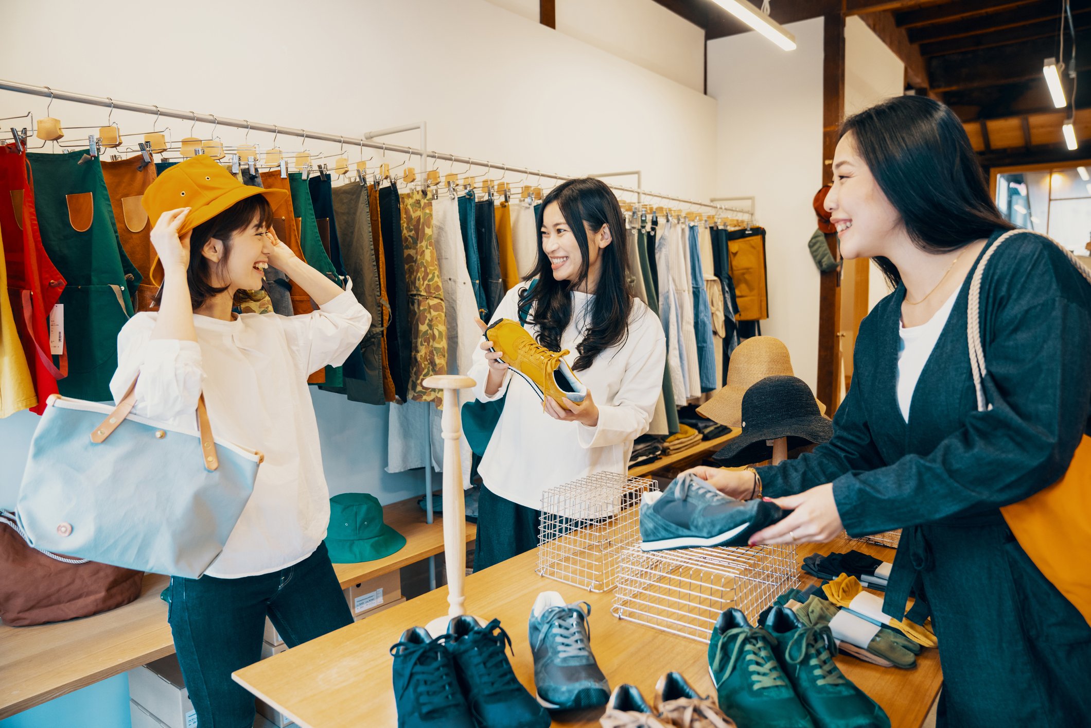 A group of shoppers at a clothing store.