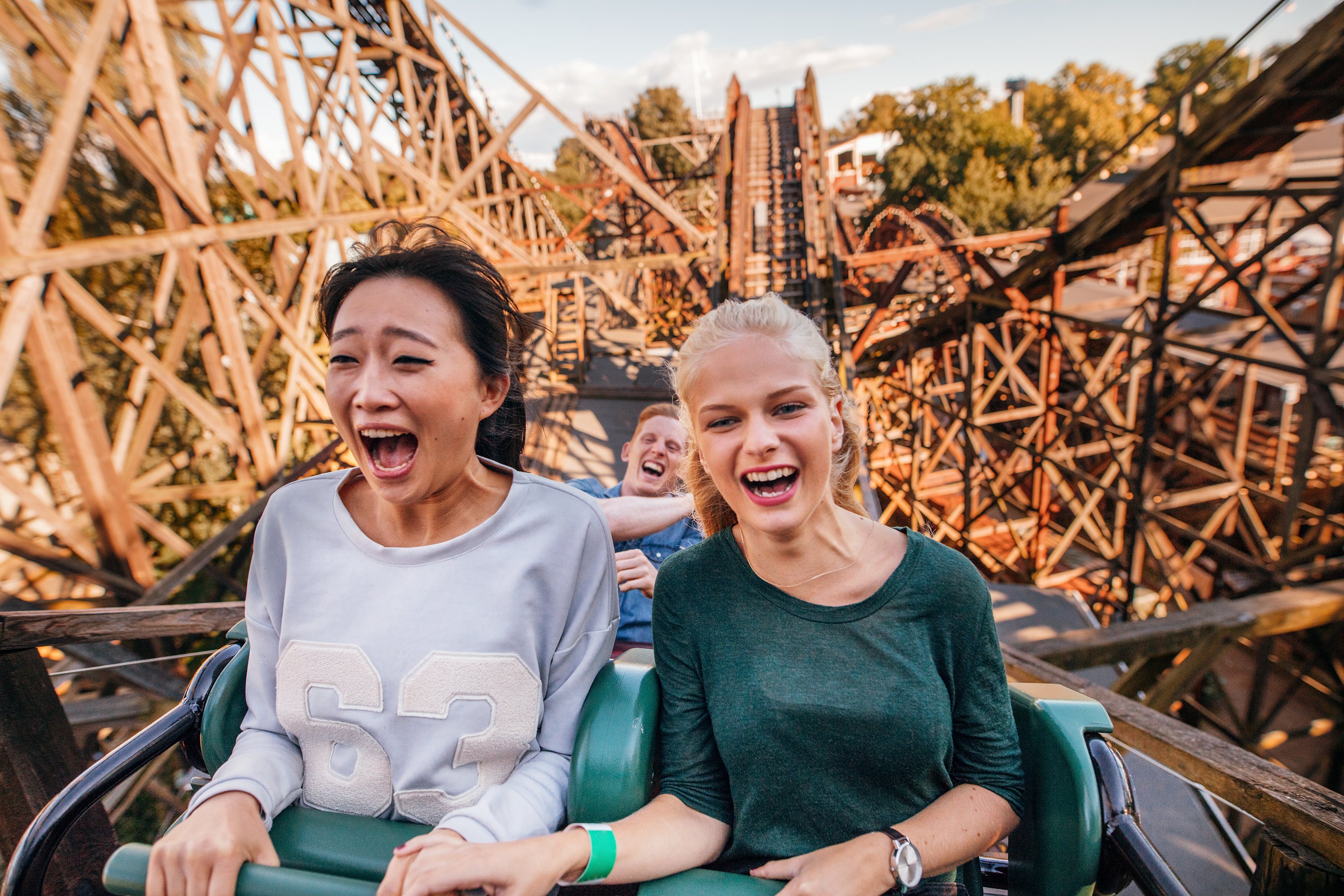 People enjoying a rollercoaster ride.
