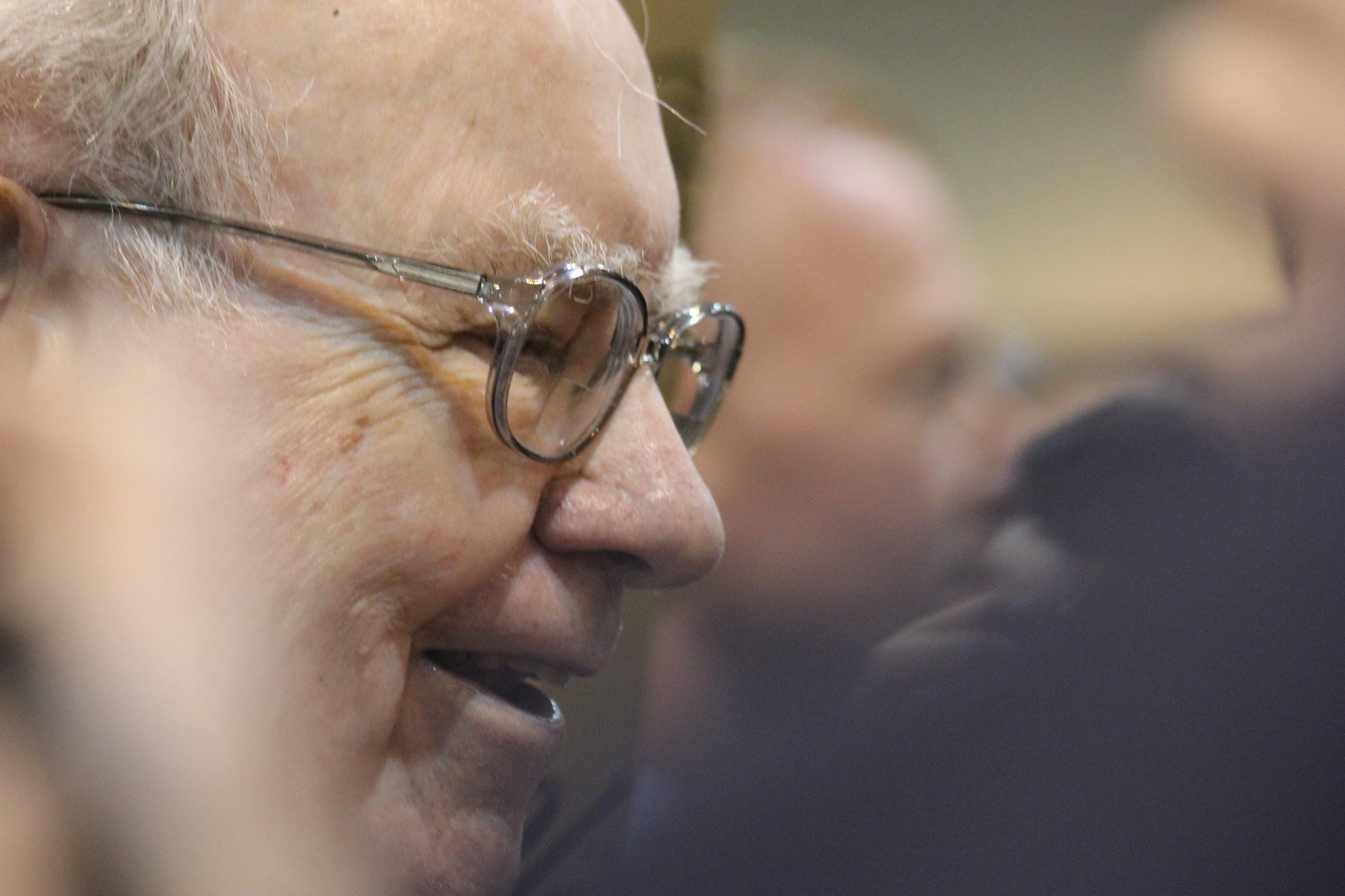A side profile of Warren Buffett.