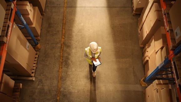Overhead shot of a worker in a warehouse.