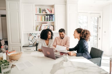insurance agent with young couple getty 1