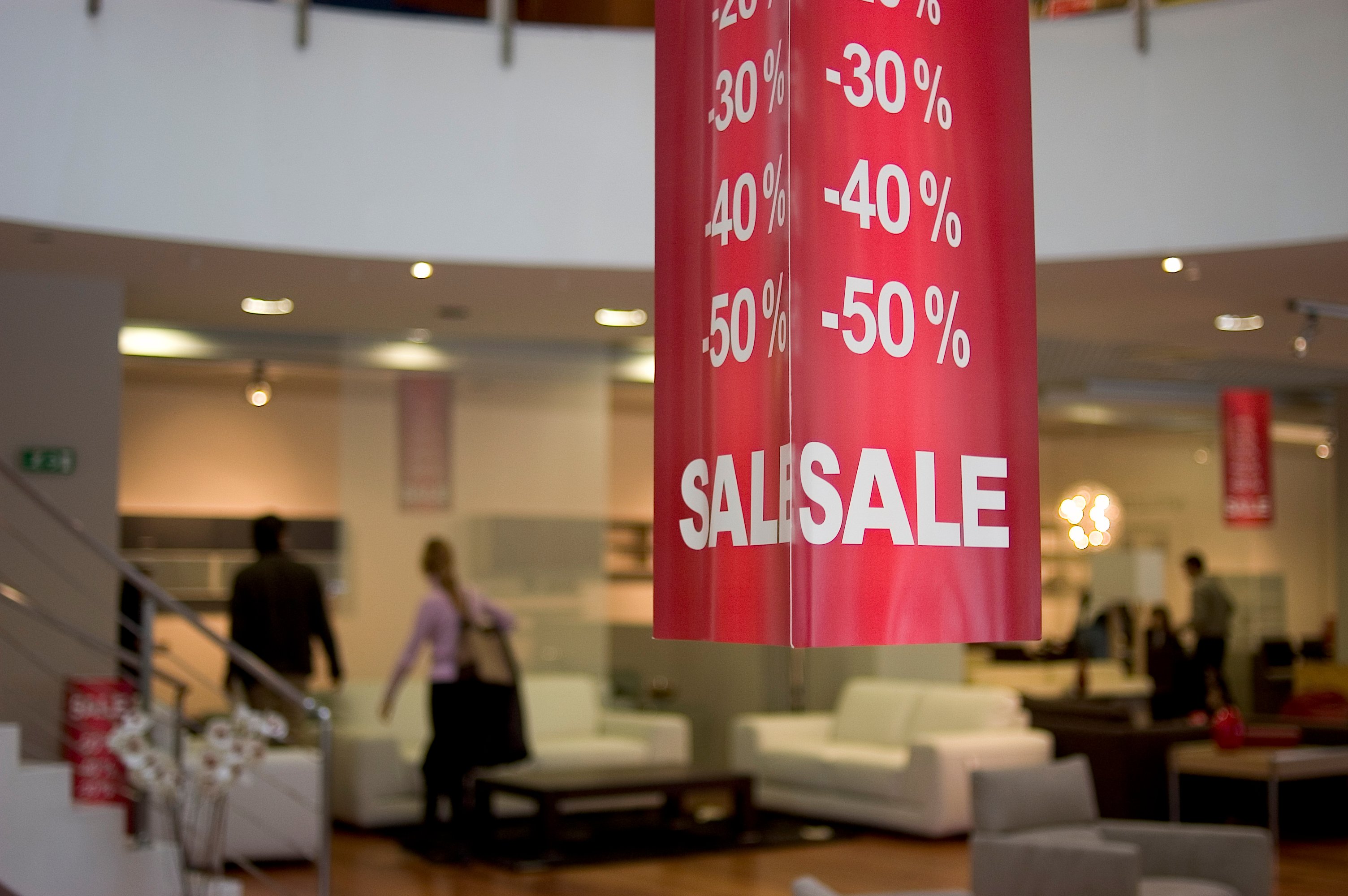 A store with a sign promoting a sale.