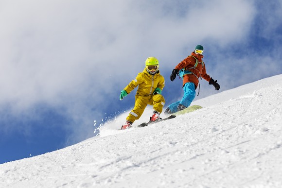 Two people skiing.