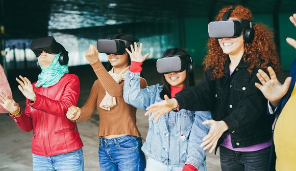 A group of people wearing virtual reality headsets.