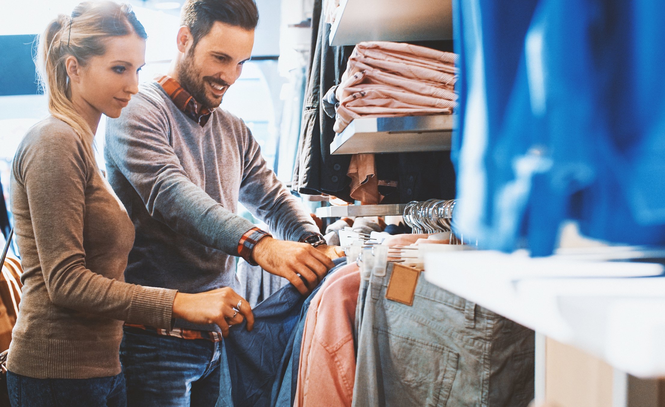 A couple shopping for apparel.