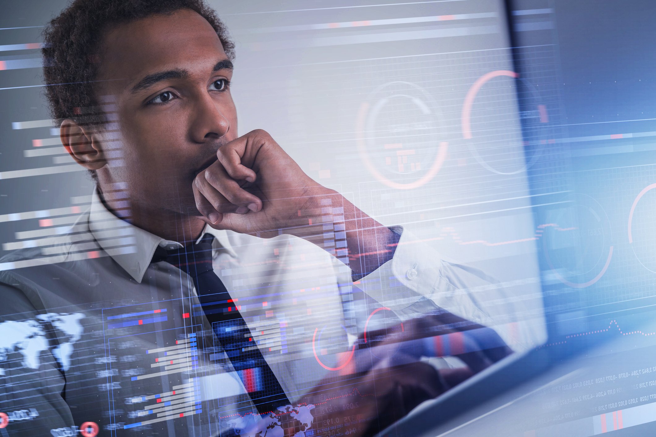 A person studies data on a computer monitor.