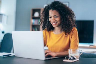 Smiling person using computer