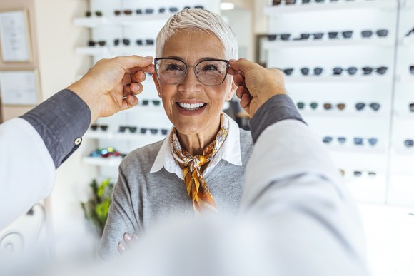 A customer tries on new glasses.