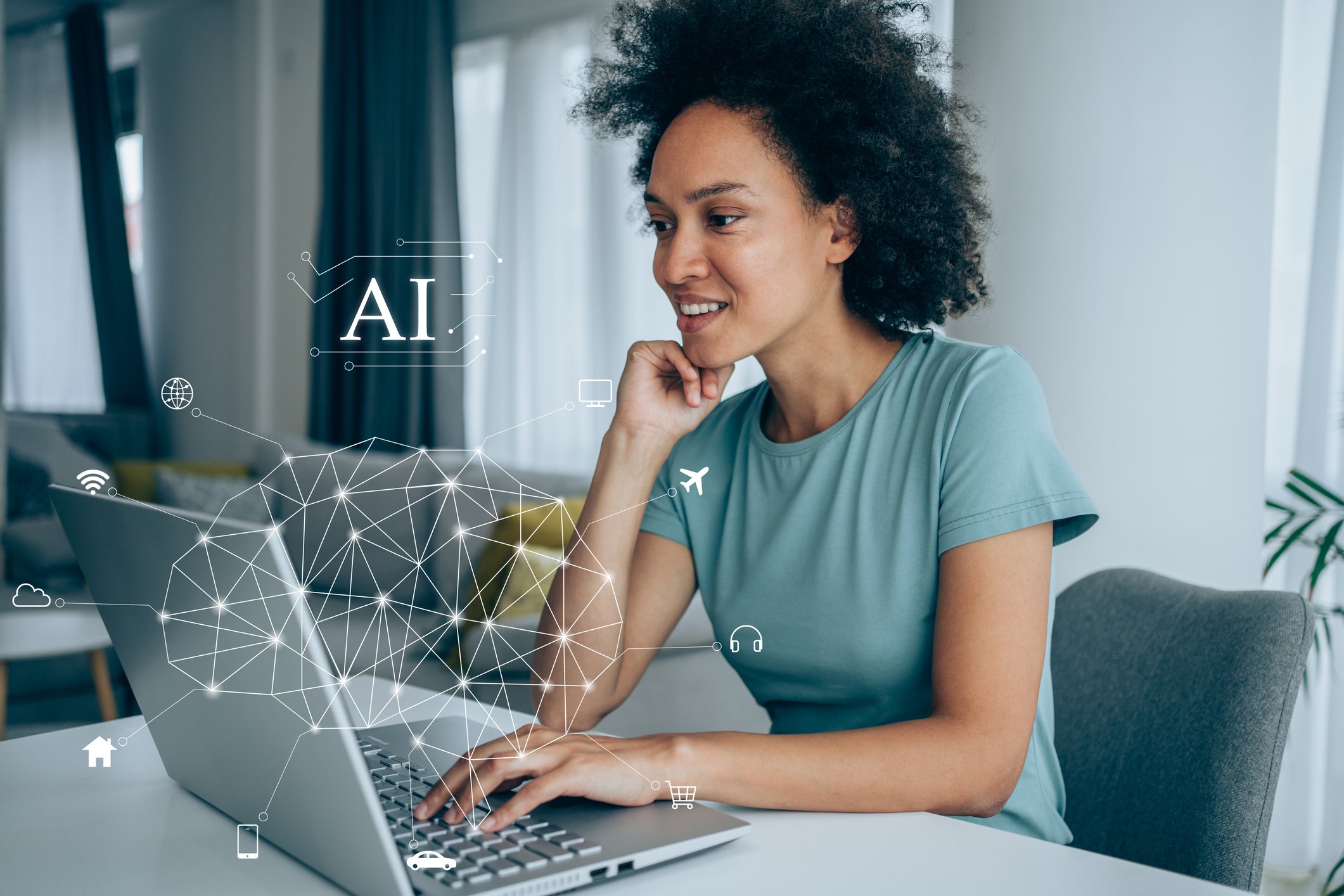 Person sitting in front of a computer with the letters AI above it.