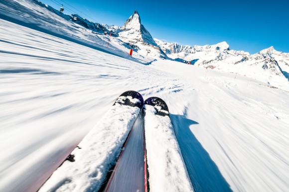 Skis going down a mountain.