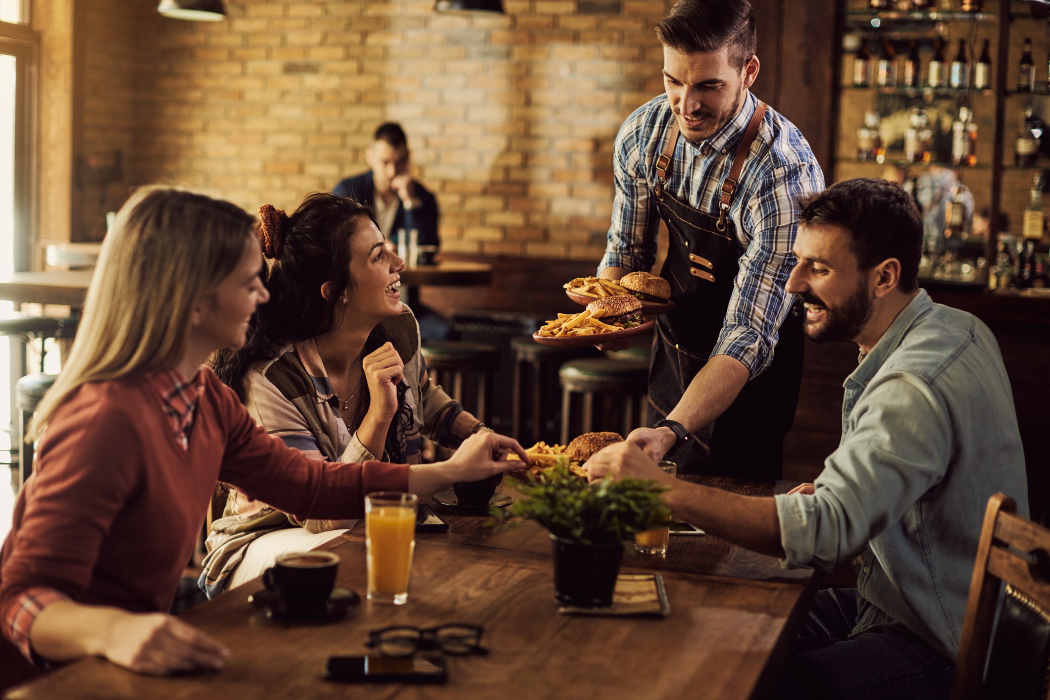 Friends eating at a restaurant.