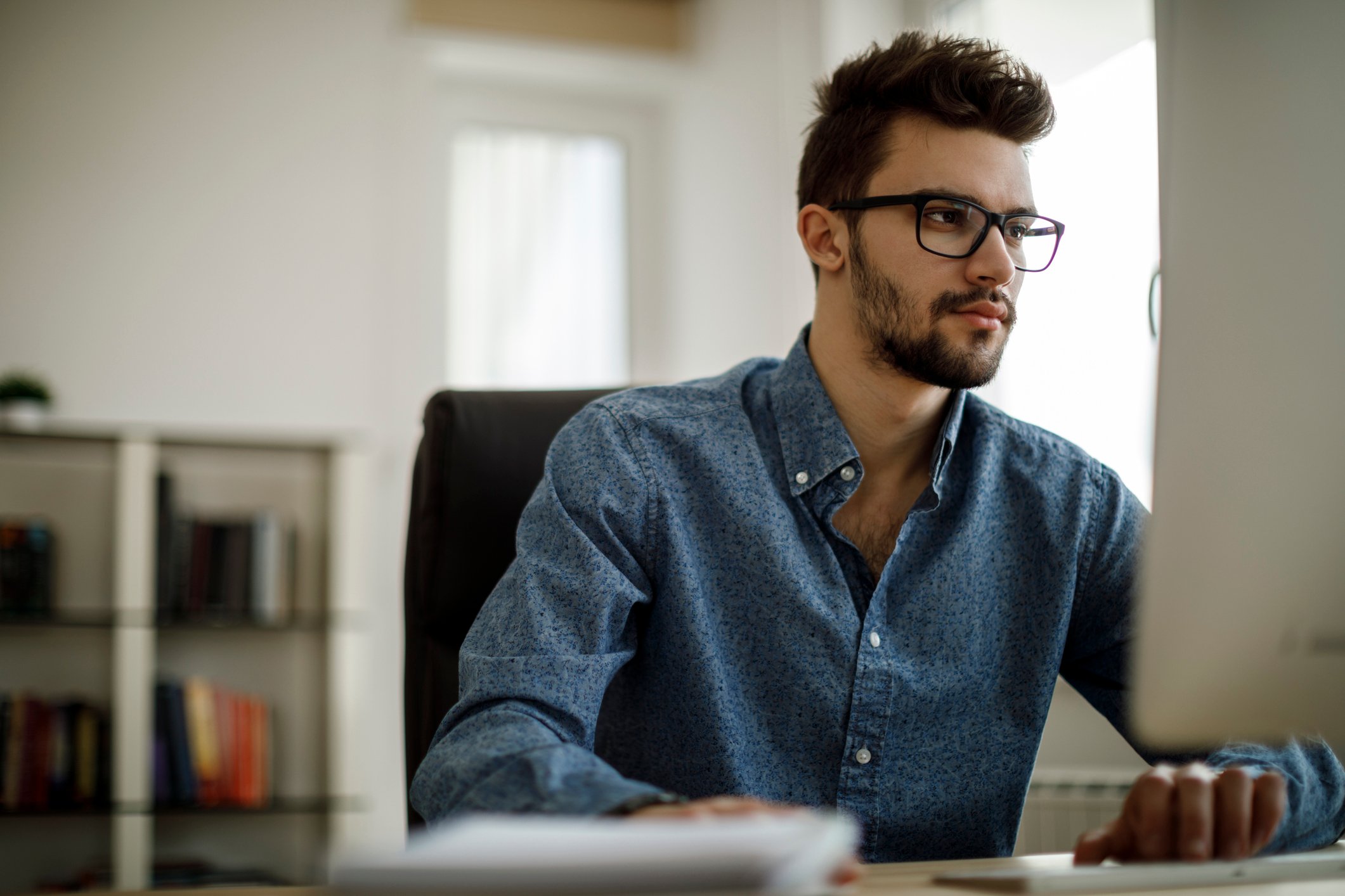 A person at a computer.