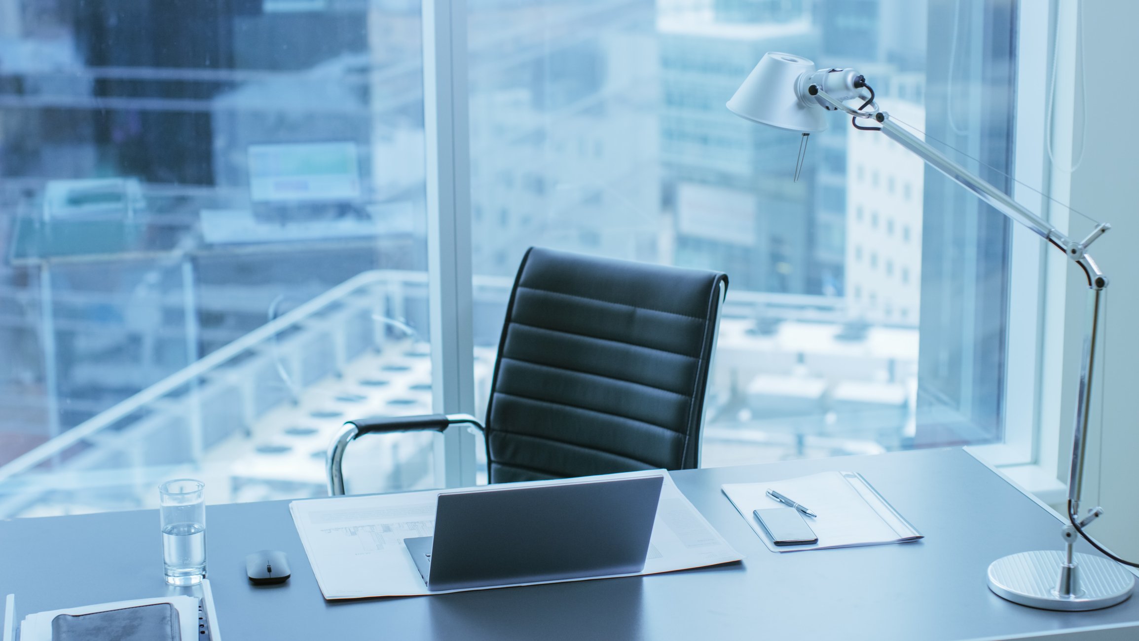 empty desk chair in a city office