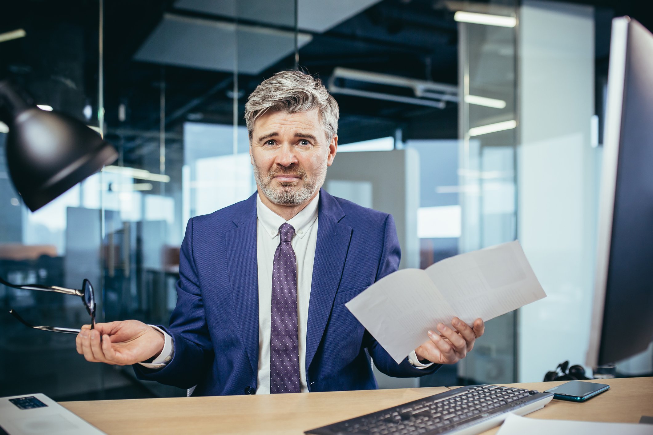 A businessperson expresses a look of disappointment.