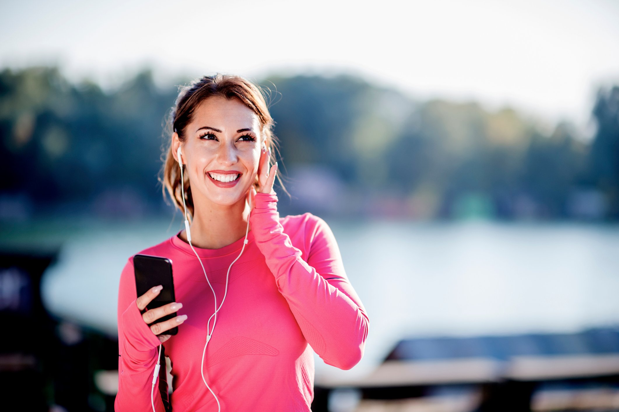 Person listening to a podcast through earbuds.