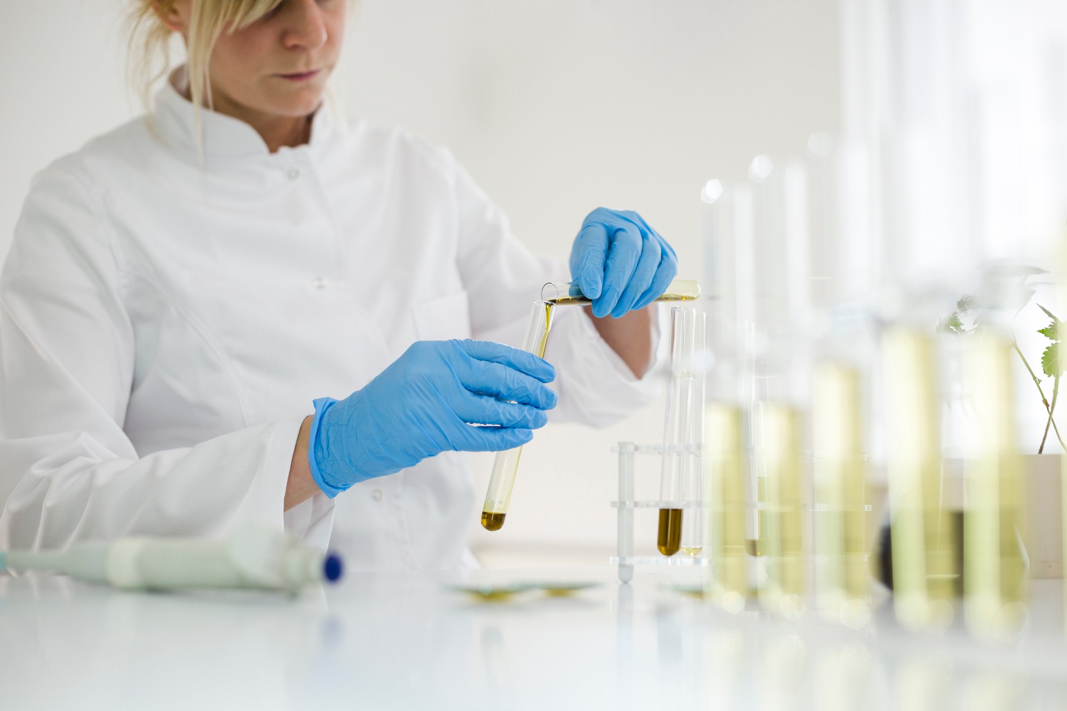 A scientist in a laboratory testing CBD oil extracted from a marijuana plant. 