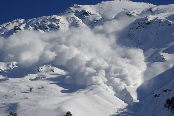Picture of an avalanche on a mountain.
