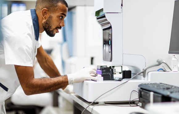 Person looking at pharmacy machine.