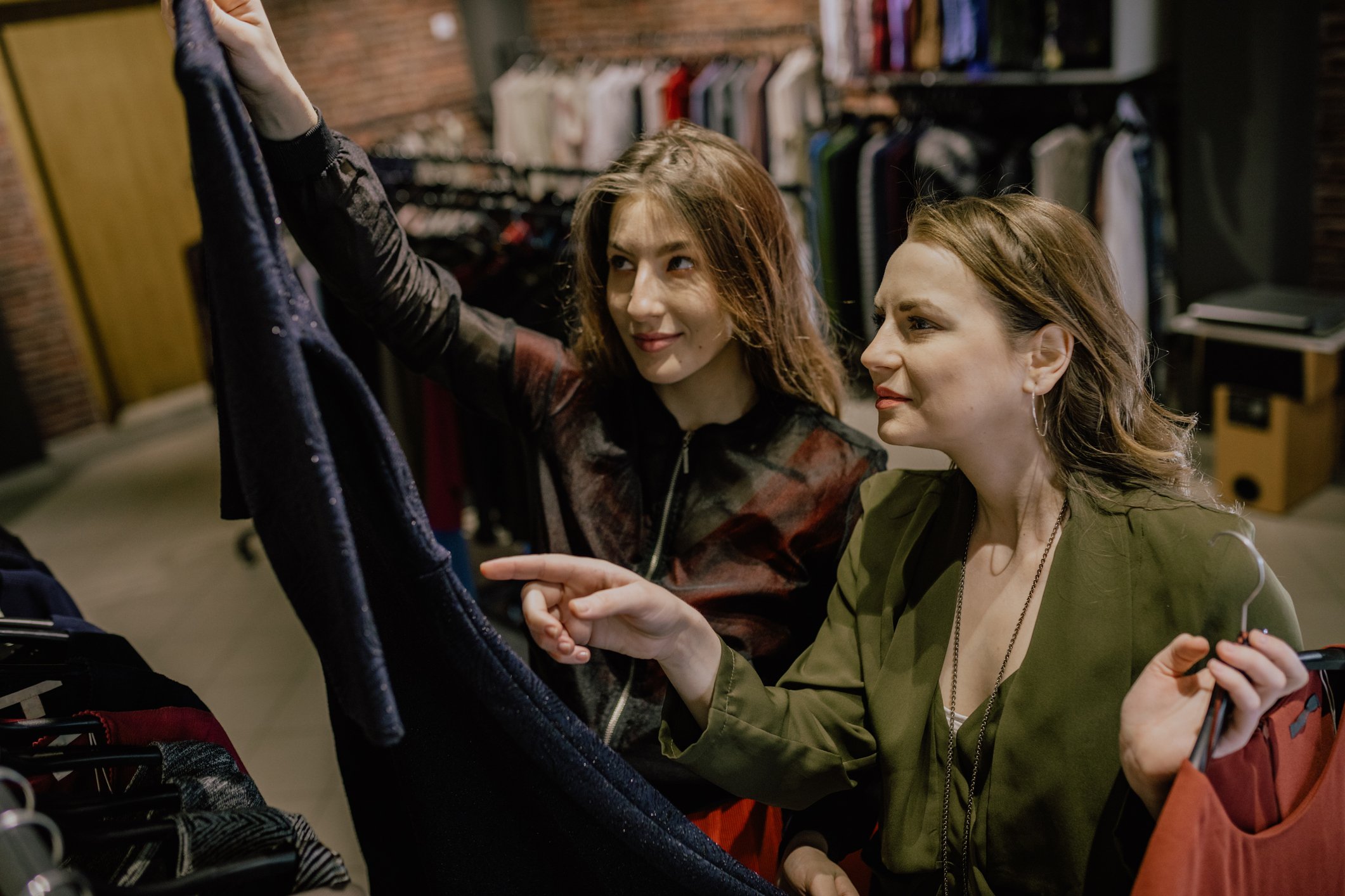 Two people shopping in a department store.