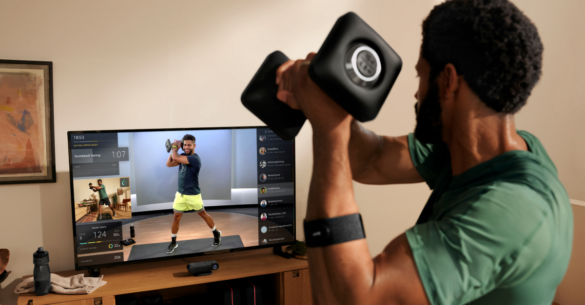 Person working out using Peloton Guide.
