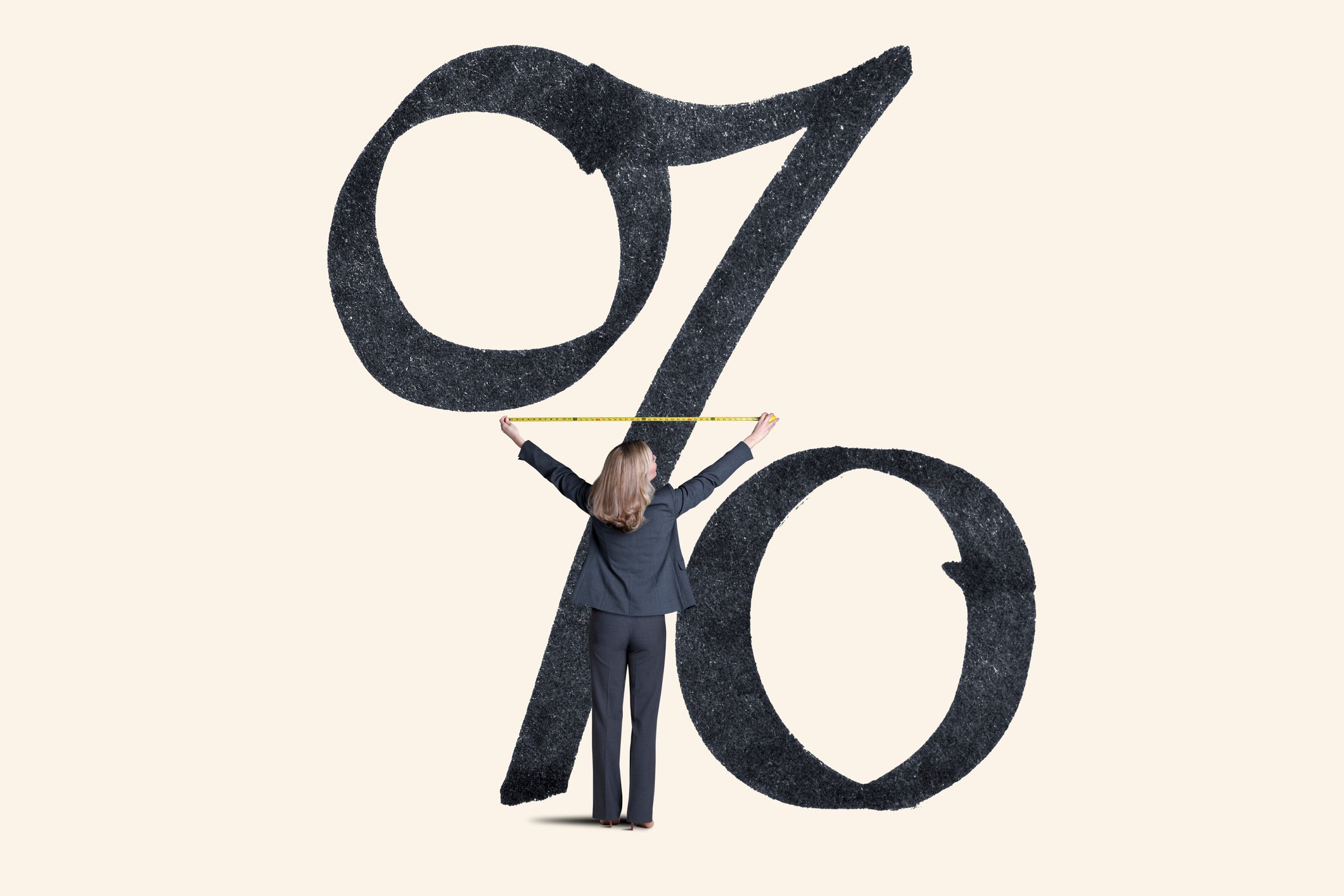 A person measuring a percentage symbol.