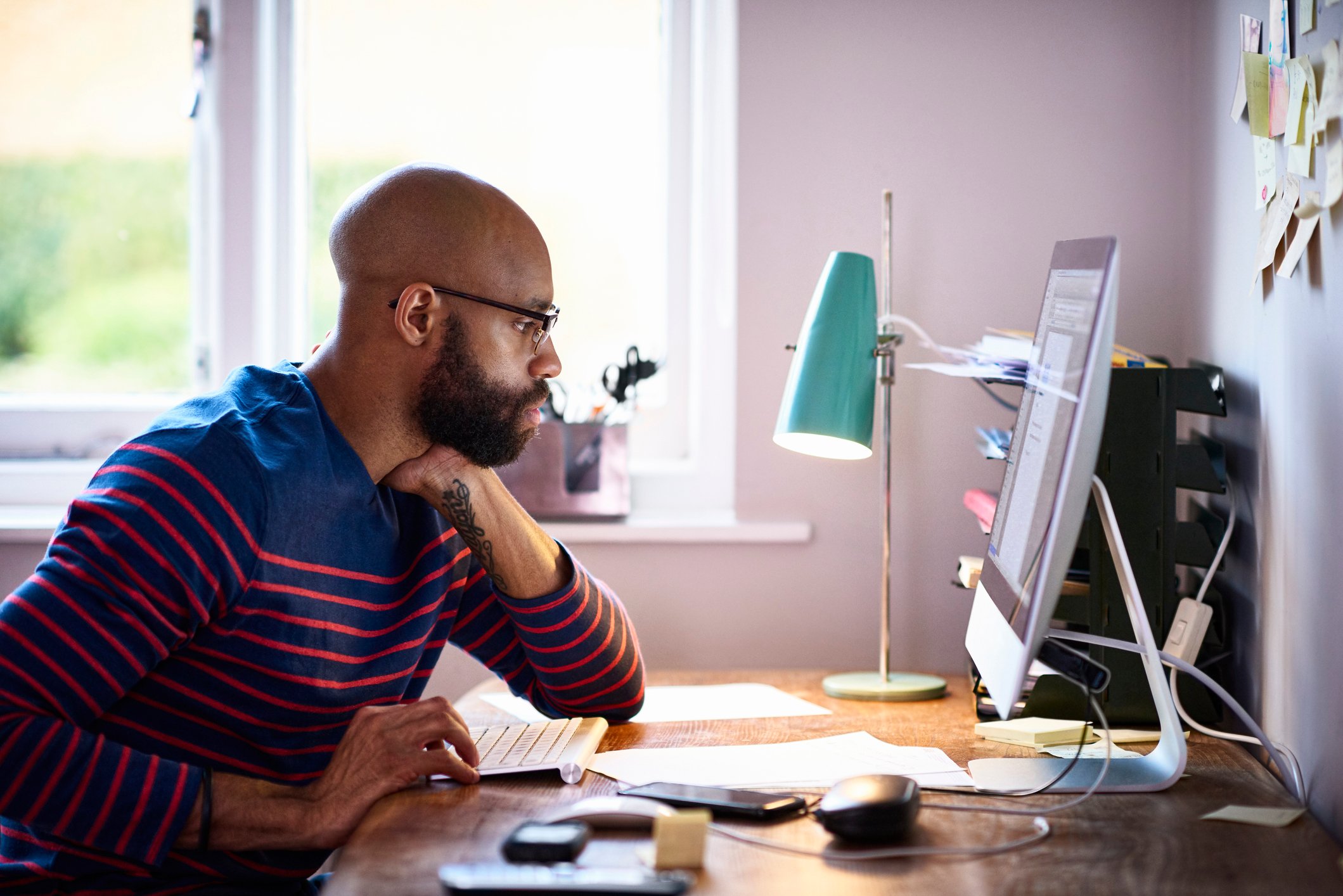 Serious person staring at computer screen.