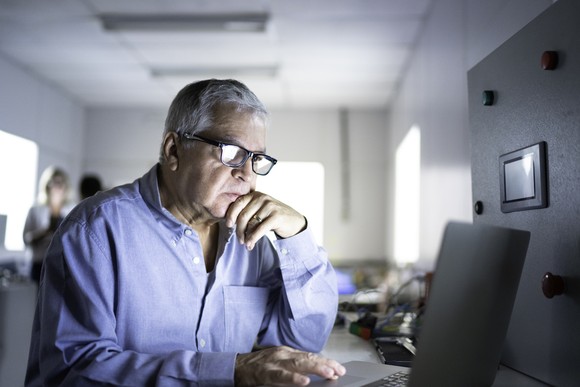 A person looking at their laptop.