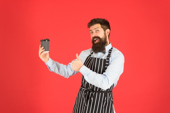 Barista having a fun time on the job.