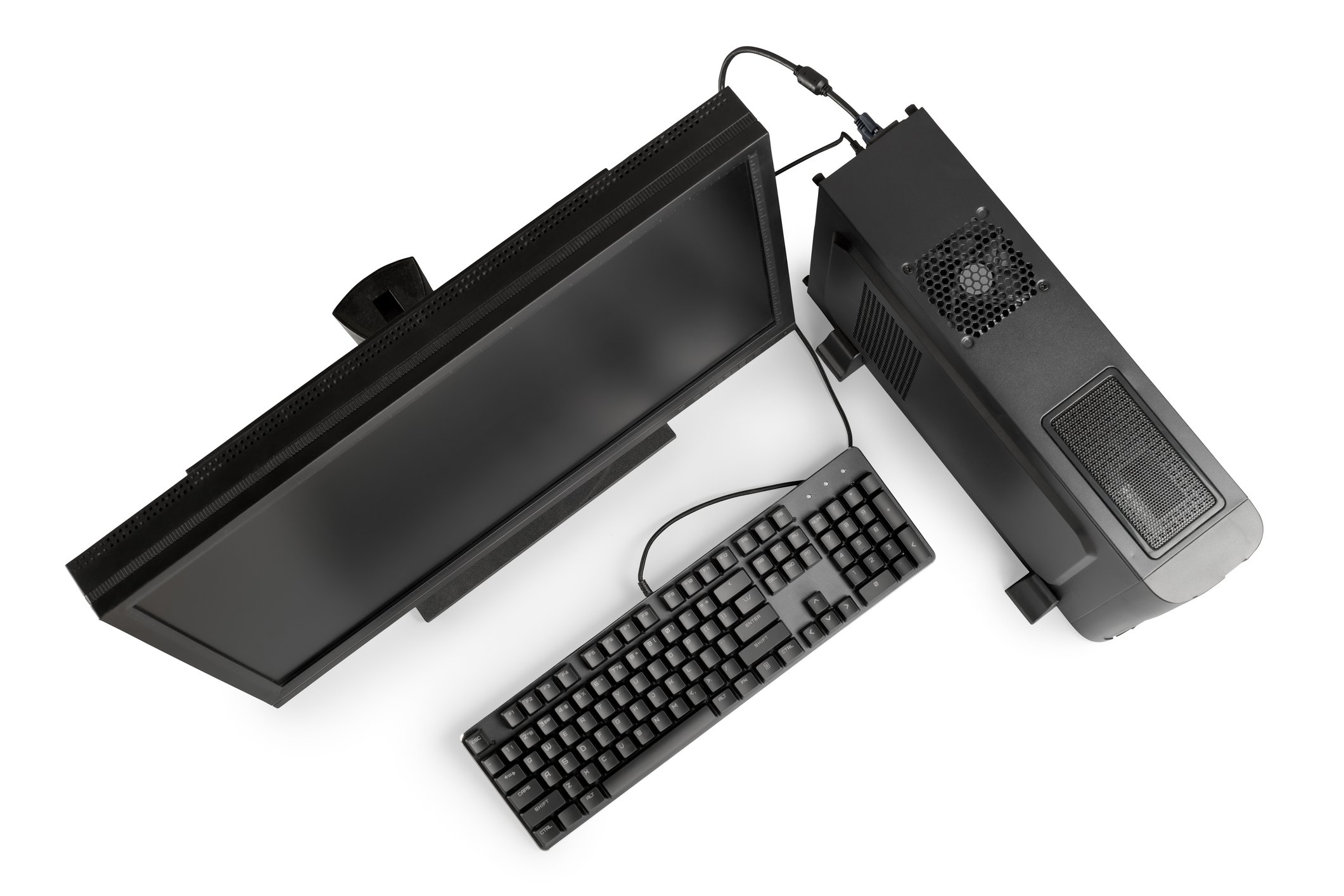 Overhead view of black desktop computer, monitor and keyboard.
