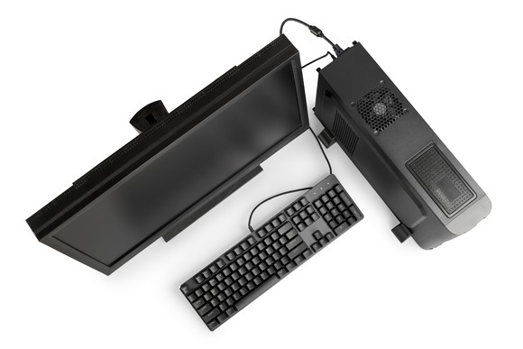 Overhead view of black desktop computer, monitor and keyboard.