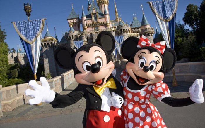 Mickey and Minnie Mouse greeting guests at Disneyland.