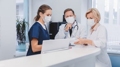 Healthcare professionals consult with each other