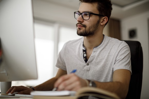A person doing work on their computer.
